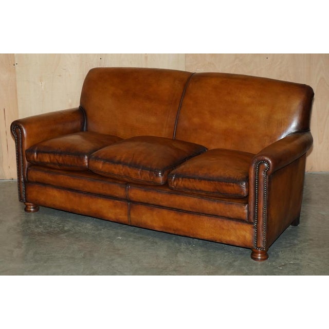Vintage fully restored hand made in England Brown Leather sofa and armchair suite. The suite has been fully restored and...