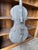 A striking large-scale hand-carved wooden sculpture in the form of a cello, blending rustic craftsmanship with sculptural...