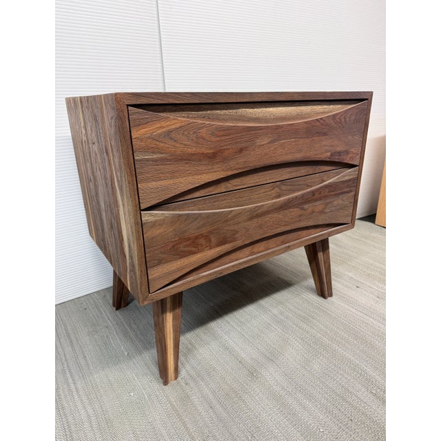 Design Plus Gallery presents the Crawford Nightstand by Brownstone. The vibrant woodgrains accentuate the mid-century...