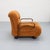 Italian lounge armchair from the late 1960s / 1970s, upholstered in a chenille fabric in a warm cognac tone and featuring...