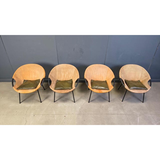 Balloon chairs designed by Lusch Erzeugnis for Lusch & Co, in Germany during the 1960s. They feature black metal frames...