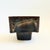 A vintage ikebana pottery bowl on a pedestal base. Earthy brown glaze and a curvy square shape. Perfect for creating a...