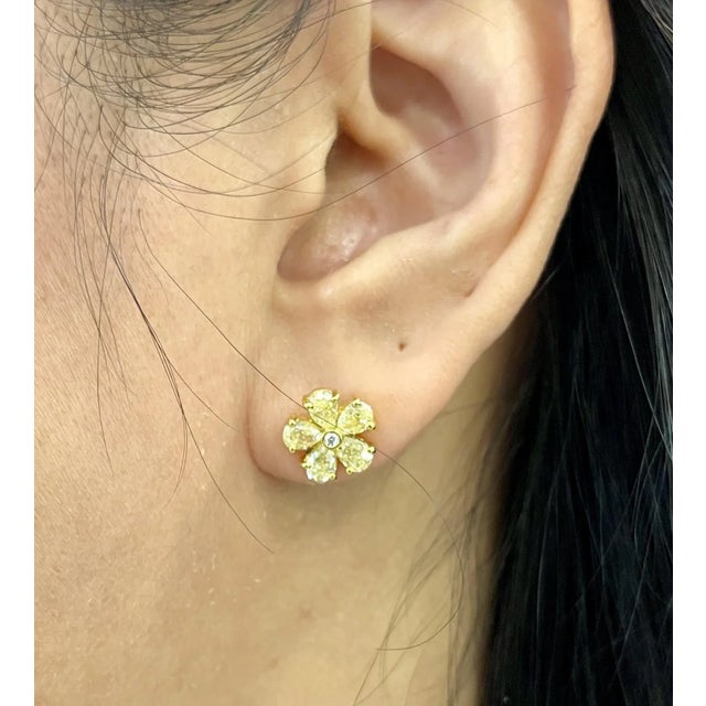 These stunning natural yellow pear shape diamond earrings feature 10 diamonds weighing 2.08 ct set in 18k yellow gold.