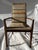 A single Merton Gershun for Dillingham furniture walnut dining arm chair with woven upholstered seat and back.