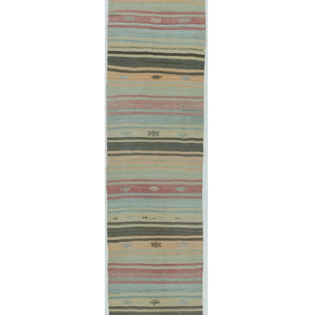 A vintage circa 1940s Turkish hand woven hemp Kilim. The simplicity and boldness of this piece gives a contemporary feel...