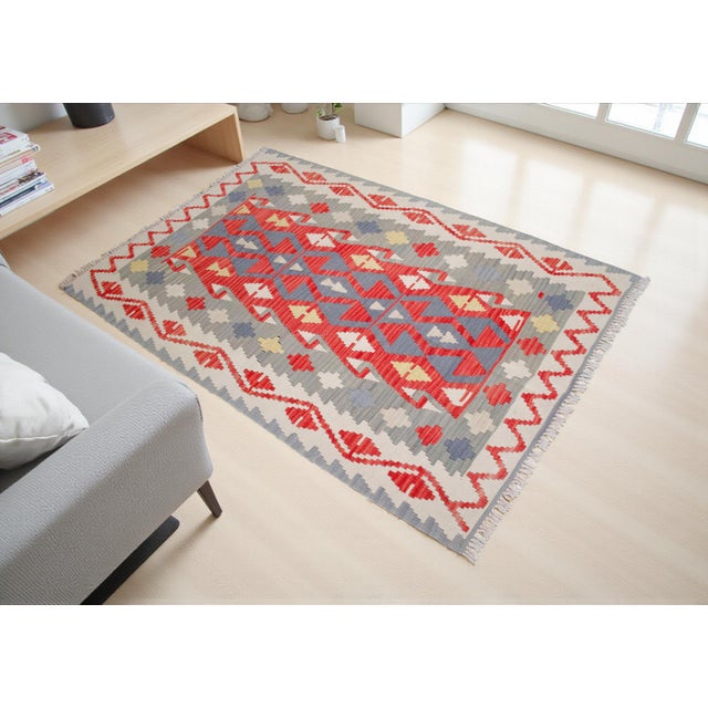 Crafted in Anatolia, this authentic, handwoven Turkish kilim offers a versatile and timeless composition for modern...
