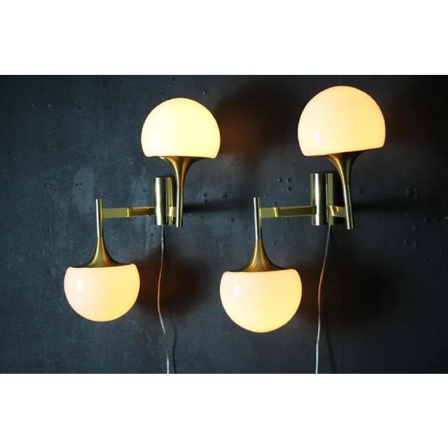 These architectural sconces are very elegant with their They are typically from 1960’s brass frame and 2 white Murano...
