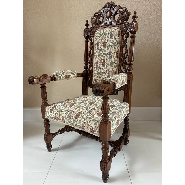 A striking mid-19th-century French carved walnut open armchair in the Louis XIII hunting style, dating to approximately...