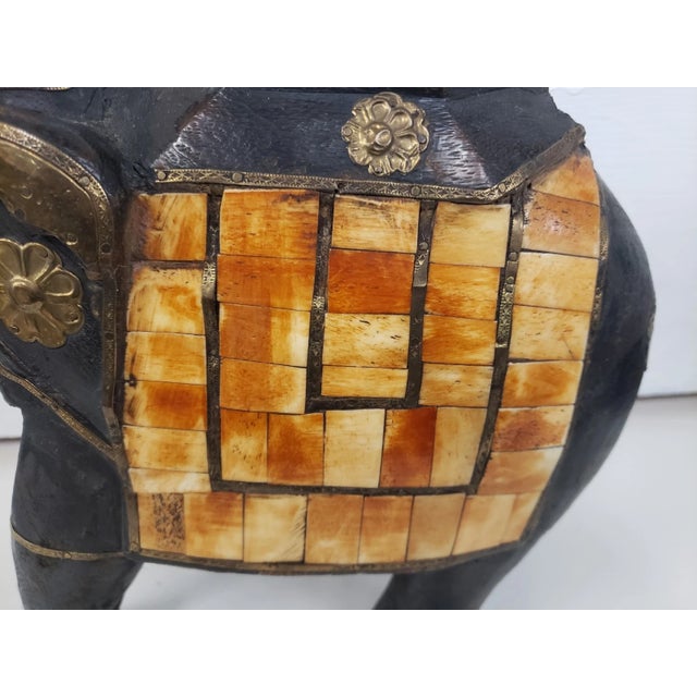 This is a Indian Traditional Wedding Style Wood Elephant Statue with Brass & Bone Accents (1960s/1970s). It measures 12"...