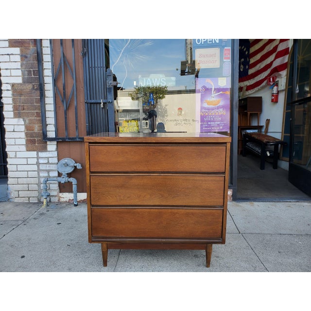 Vintage American made walnut low boy. The low boy features three drawers with dovetail construction. The piece is most...