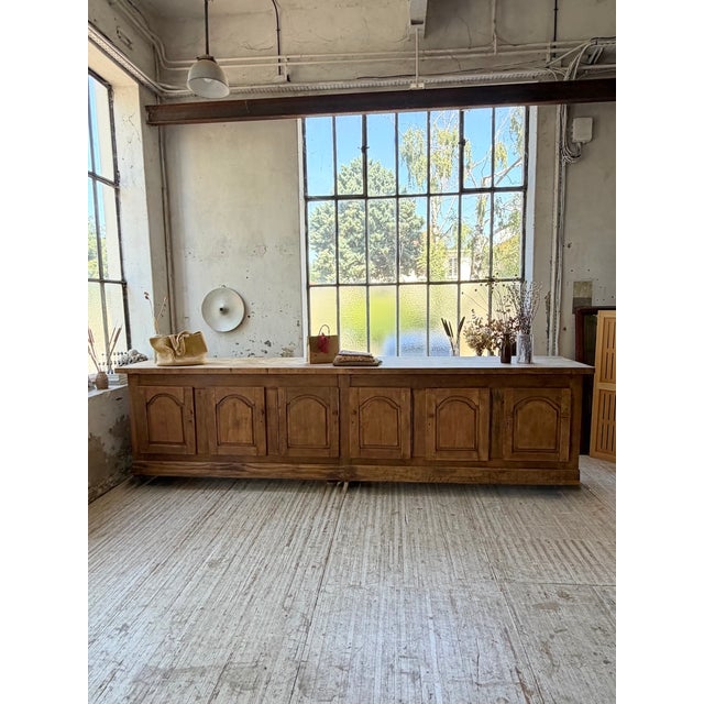 A vintage sideboard, reminiscent of a counter or kitchen island, dating back to the 1950s, with its rustic country house...