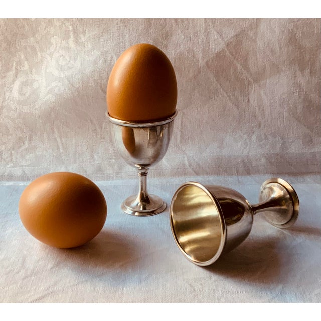 … A charming antique silverplate egg serving set from about 1900, made for a proper breakfast table. Six footed egg cups,...