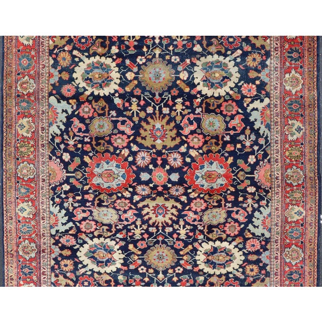 Measures: 7' x 10'4 Antique Persian Mahal Rug with Rich Navy Field and Stylized Botanical Motifs. Keivan Woven Arts / rug...
