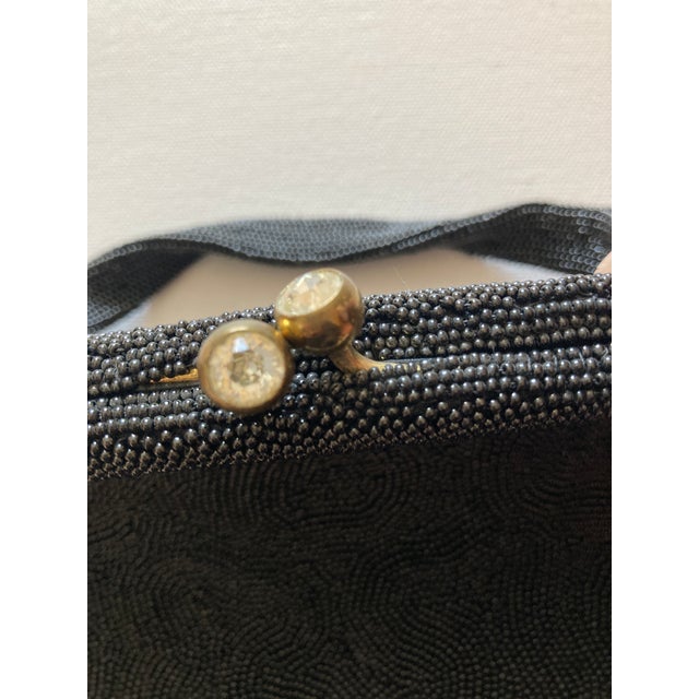 Beautiful vintage estate Lucille de Paris black hand beaded evening bag with jewel clasp. Made in Belgium. Satin interior....