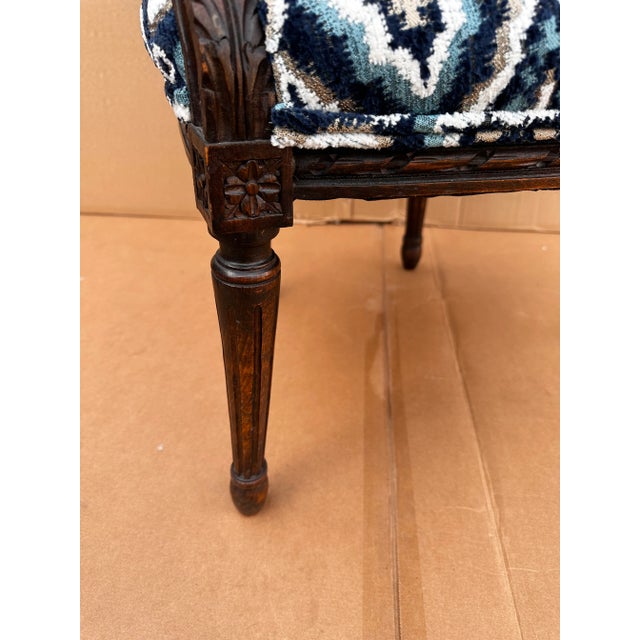 This is an absolutely stunning French chair! The antique frame is a deep brown wood with hand carve detail all along the...