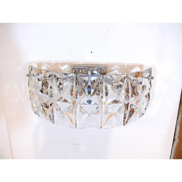 Fantastic pair of German sconces by Kindeley with seven gleaming prismatic glass pieces hung by chrome back frame. Each...