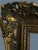 A beautifully sculpted French giltwood frame featuring elaborate floral ornaments, scrolling foliage and decorative relief...