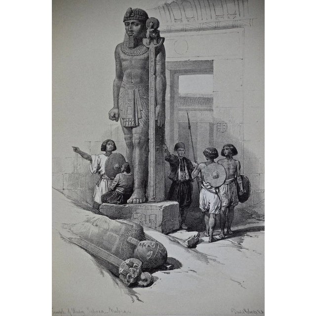 "Colossus in Front of the Temple of Wady Saboua, Nubia" is a 19th century half-folio sized duo-tone lithograph from the...