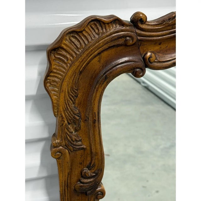 Beautifully crafted mirror by Henredon from the Villandry Collection. The wood frame features lovely carved details....
