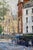 Streets of London, 2023 captures a bustling urban scene, where the interplay of light and shadow animates the textured...