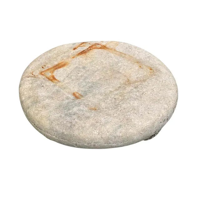 A beautiful, well-worn, 19th century Indian chapati plate with three short legs and a smooth surface only 100 years of use...