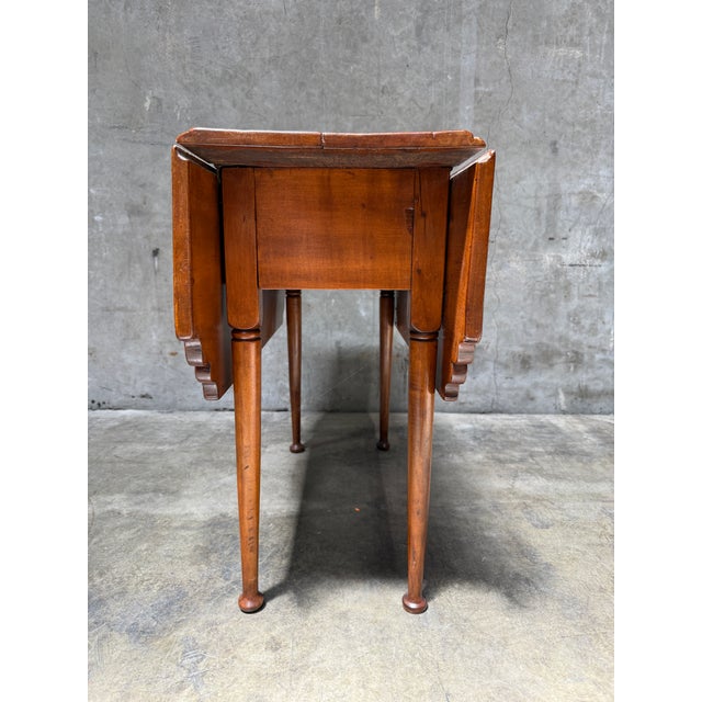 Type: Diminutive drop-leaf / breakfast / side table Era: 18th century, c. 1760–1790 (Queen Anne period) Origin: American,...