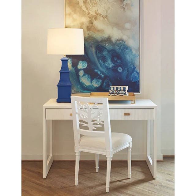 The Allegra handpainted tiered tole table lamp in a cheerful royal blue. Perfect to add a punch of color to any room. UL...