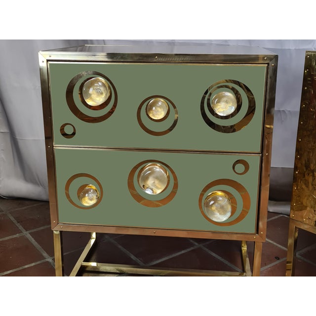 Pair of green murano glass bedside tables handmade in italy. These beautiful pieces feature polished birch wood...