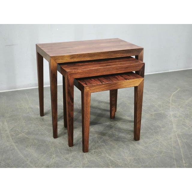 A refined set of three nesting tables designed by Severin Hansen and produced by Haslev Møbelsnedkeri in Denmark during...