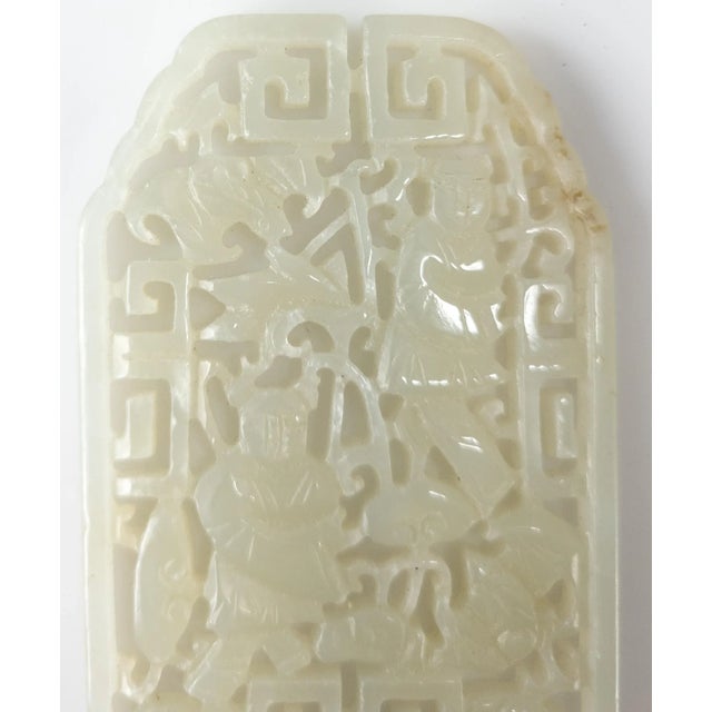 We are selling this well carved Chinese White Nephrite Hetian jade plaque with two boys and two bats with reticulated...