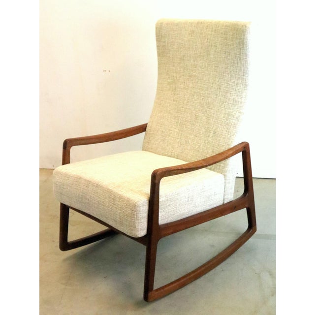 This beautiful Mid Century Modern rocking chair is a masterpiece by the renowned Danish designer Ole Wanscher. A prominent...