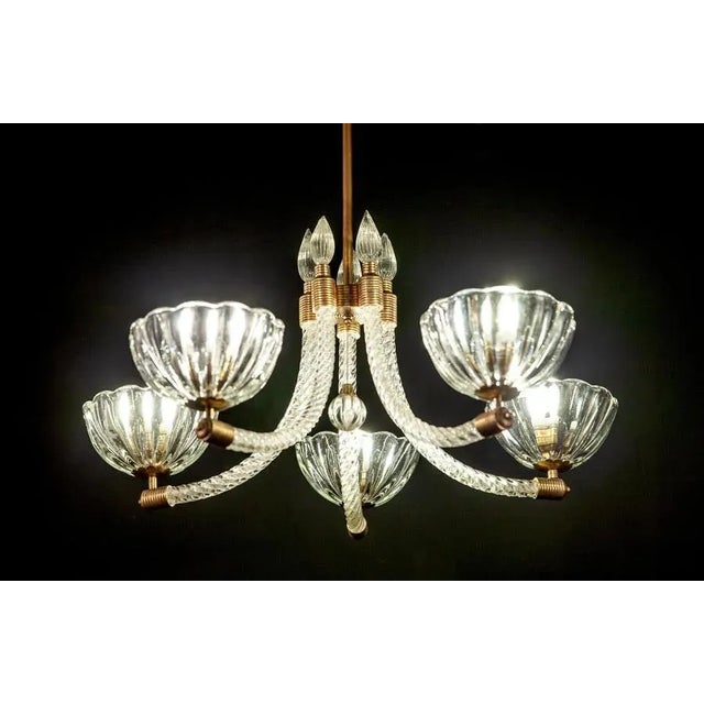 Elegant brass mounted Art Deco five arms Murano glass chandelier by Barovier & Toso. We can shorten the rod on request. Up...