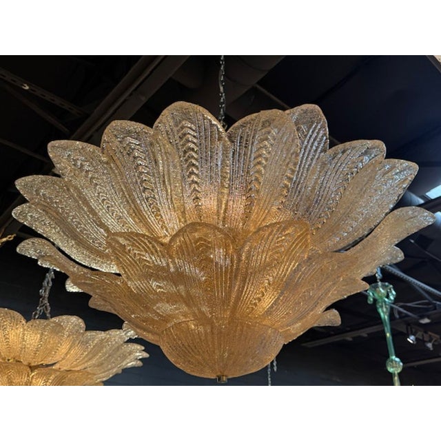 This Gold Murano Glass Leaf Form Flush Mount Chandelier is a beautiful and elegant lighting fixture. Made with high-...