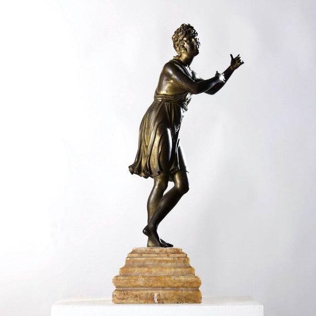 A beautiful gilt bronze figure of Apollo on an alabaster base. Dimensions: 17.32 inches high x 5.13 inches wide x 5.13...