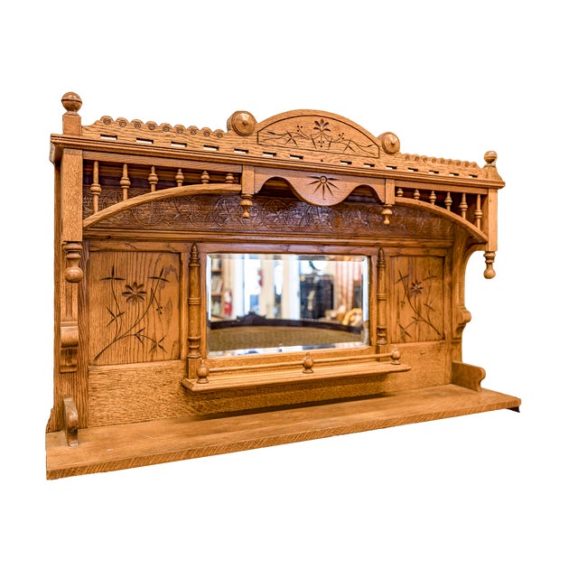 A beautiful Eastlake Era wall mirror with shelf.