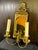 Vintage Brass Double Arm Hardwired Wall Sconce With Mirror. Traditional scallop motif at top. Tinted yellow mirrored...
