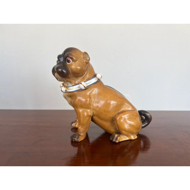 German, late 19th century. An antique German porcelain model of a seated pug.