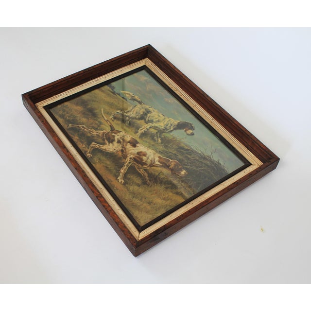 Framed vintage sporting art print captures classic pointer or setter hunting dogs in an outdoor field, by artist Edmund...