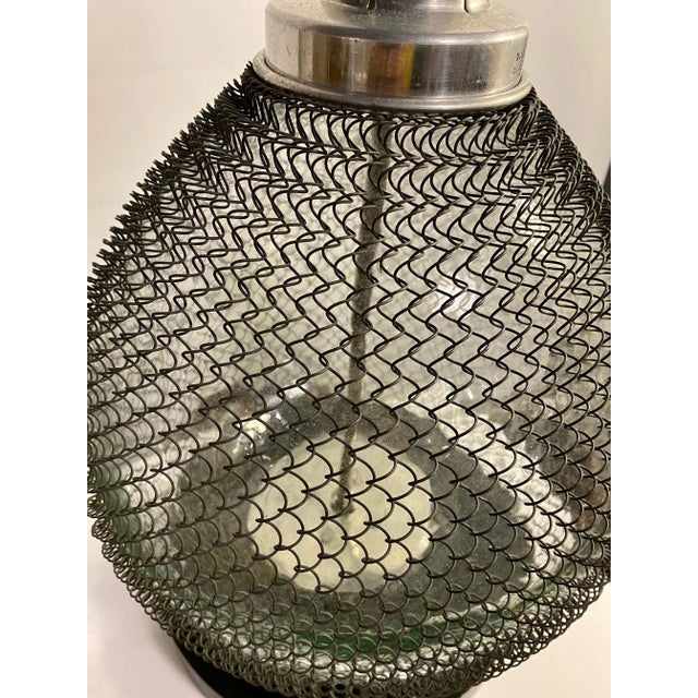 Vintage Large Vintage French Seltzer Bottle converted into a table lamp. Features bulbous glass seltzer bottle body with...