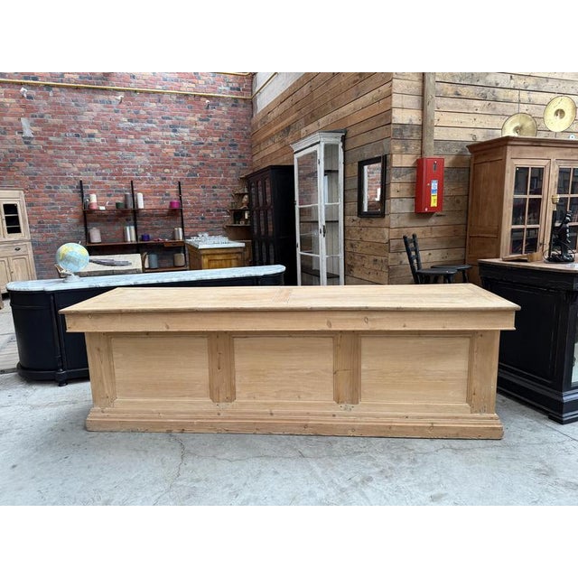 This former large display counter has been completely restored. It features a beautiful oak top and a fir wood frame. On...