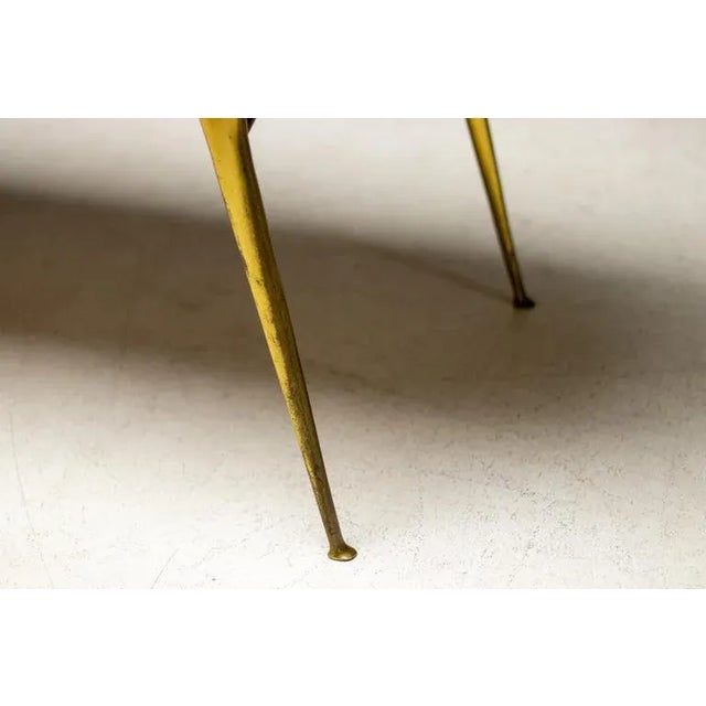 Very elegant Italian 1950s coffee table with a polished brass base and marble top. Excellent Italian craftsmanship and...