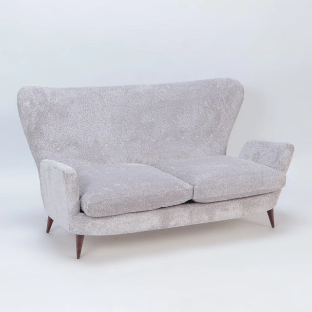 This delightful high-back settee, attributed to Emilio Sala and Giorgio Madini in Italy during the 1950s, exemplifies the...