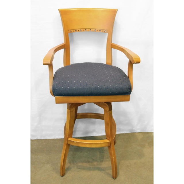 Vintage Traditional style maple bar chair; the high back features a circular cut-out detail on the edge, complemented by...