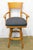 Vintage Traditional style maple bar chair; the high back features a circular cut-out detail on the edge, complemented by...