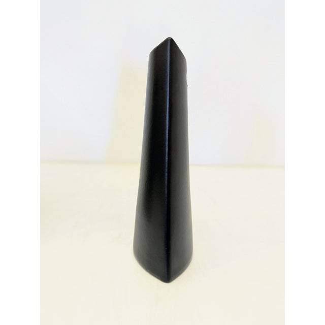 Vintage ceramic vase produced by Evangeline Pottery of Labelle, Quebec. Executed in a matte black glaze, the vase features...