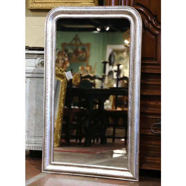 Crafted in the Burgundy region of France circa 1880, this elegant antique Louis Philippe mirror features the classic...