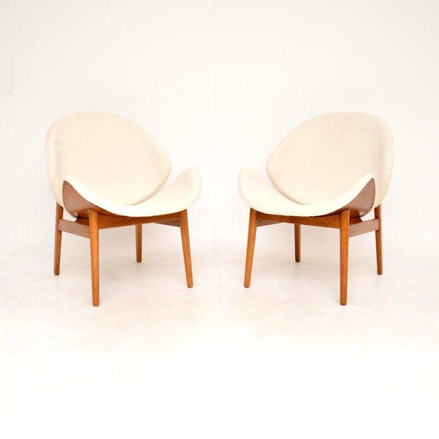 A stunning and iconic pair of Danish vintage lounge chairs by Hans Olsen. They were made by N.A Jorgensen in Denmark, and...