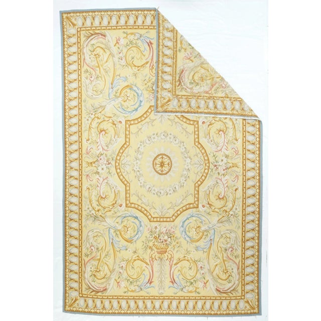 Refers generally to modern carpets in tapestry technique and inspired by French Aubusson designs of the 18th and later...