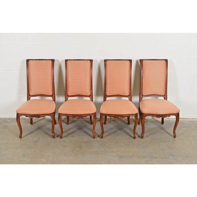 An outstanding set of four French Rococo or French Provincial Louis XV style dining chairs By Baker Furniture USA, Circa...