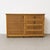 Vintage low sideboard in woven rattan with a bamboo-style structure and a warm natural honey tone. a decorative and...